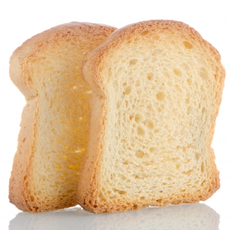 Two pieces of golden brown toast on white background.の写真素材