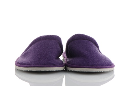 A pair of purple slippers on a white background.の写真素材
