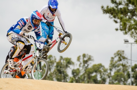 ESTARREJA, PORTUGAL - MAY 26: Carlos Rosado, on the left, leading the race at the 2nd Portugal Bmx Open on may 26, 2013 in Estarreja, Portugal.のeditorial素材