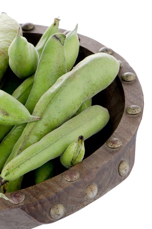 green beans pod on wooden bowl isolated on white background.の写真素材
