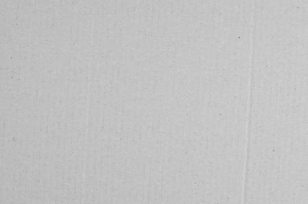 Detailed closeup of a grey cardboard texture background.の写真素材
