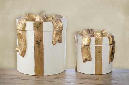 Christmas decorative white gift boxes with golden ribbon.
