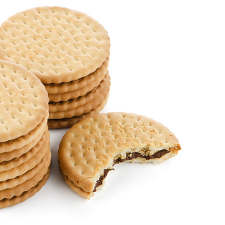 Sandwich biscuits with chocolate filling on a white backgroundの写真素材