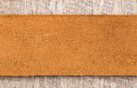 Leather belt over wooden background.の写真素材