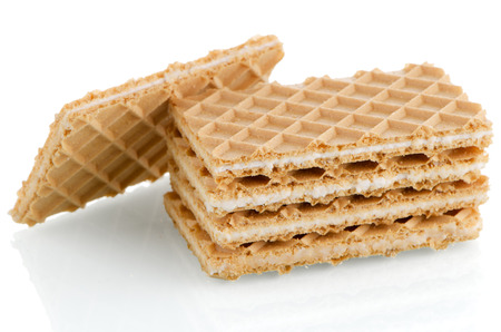 Vanilla wafers on white reflective background.の写真素材