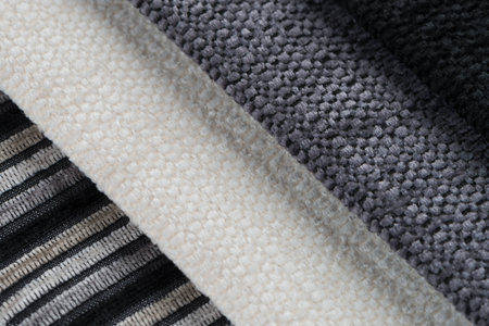 Closeup detail of multi color fabric samples texture background.