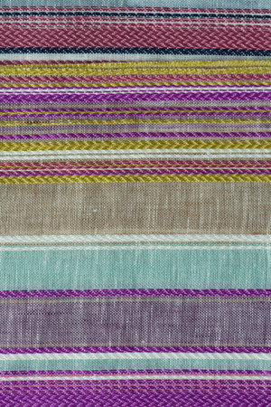 Closeup detail of multi color fabric texture samples.
