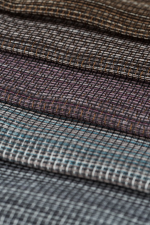 Closeup detail of multi color fabric texture samples.