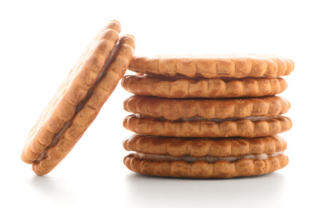 Sandwich biscuits with vanilla filling on a white backgroundの写真素材