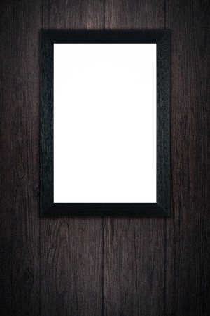 Old picture frame on vintage wood wall.の写真素材