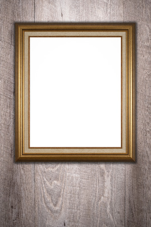 Old picture frame on vintage wood wall.の写真素材
