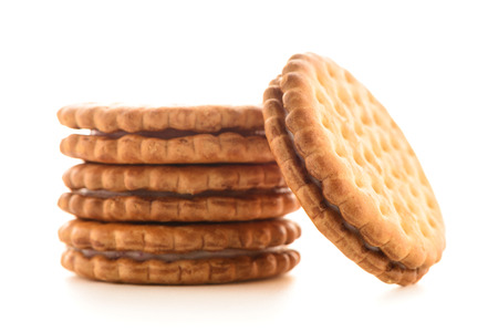 Sandwich biscuits with vanilla filling on a white backgroundの写真素材