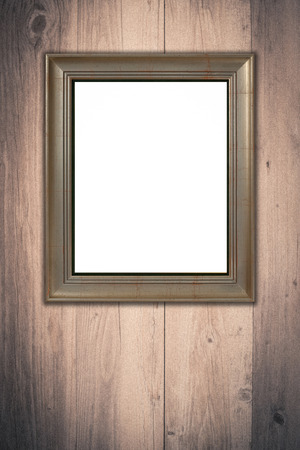 Old picture frame on vintage wood wall.の写真素材