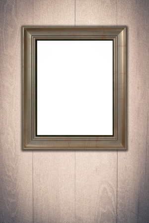 Old picture frame on vintage wood wall.の写真素材