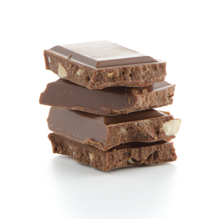 Closeup detail of chocolate parts on white background.の写真素材