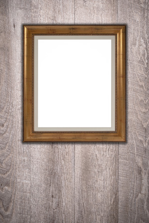 Old picture frame on vintage wood wall.の写真素材