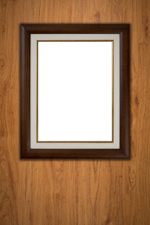 Old picture frame on vintage wood wall.の写真素材