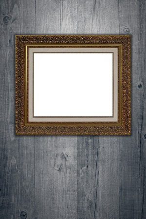 Old picture frame on vintage wood wall.の写真素材