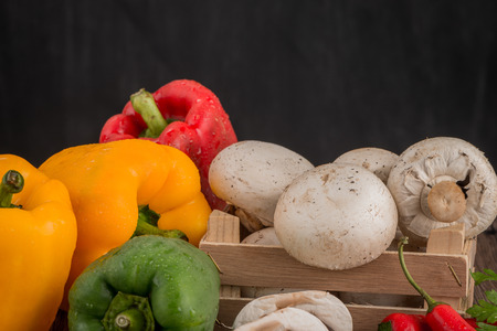 Vegetables on wooden box on wooden table backgroundの写真素材