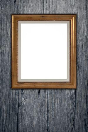 Old picture frame on vintage wood wall.の写真素材