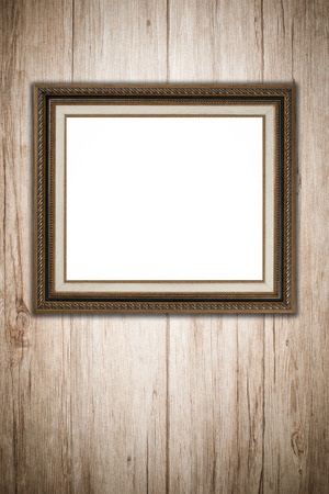 Old picture frame on vintage wood wall.の写真素材