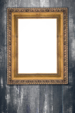 Old picture frame on vintage wood wall.の写真素材
