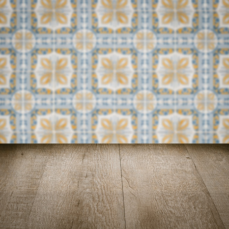Empty wood table top and blur vintage ceramic tile pattern wall in background, Mock up template for display of your product.の写真素材