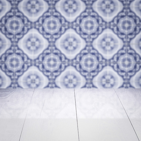 Empty wood table top and blur vintage ceramic tile pattern wall in background, Mock up template for display of your product.の写真素材