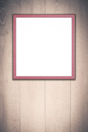 Old picture frame on vintage wood wall.の写真素材