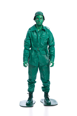 Man on a green toy soldier costume isolated on white background.の写真素材