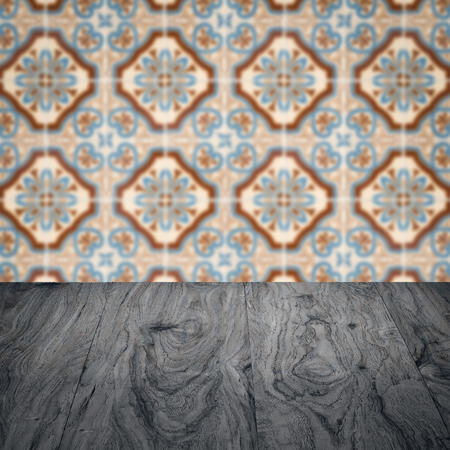 Empty wood table top and blur vintage ceramic tile pattern wall in background, Mock up template for display of your product.の写真素材