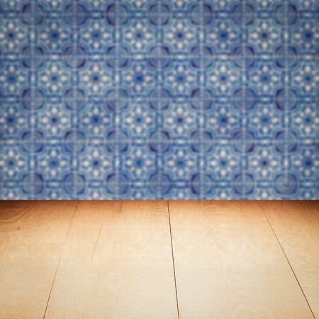 Empty wood table top and blur vintage ceramic tile pattern wall in background, Mock up template for display of your product.の写真素材