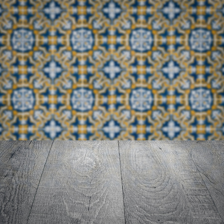 Empty wood table top and blur vintage ceramic tile pattern wall in background, Mock up template for display of your product.の写真素材
