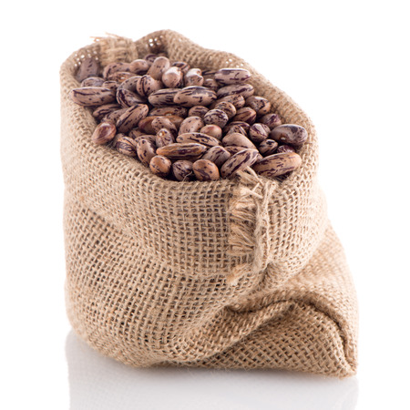 Pinto beans bag on white background.の写真素材