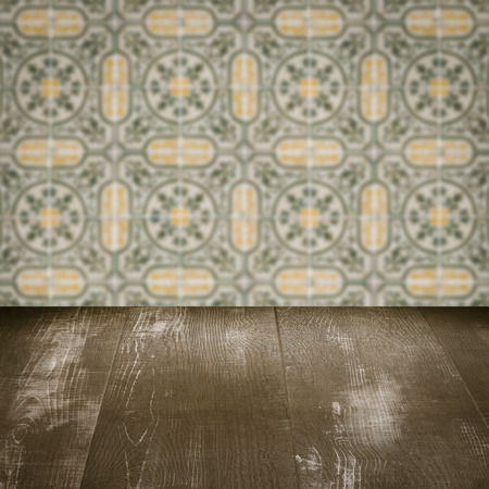 Empty wood table top and blur vintage ceramic tile pattern wall in background, Mock up template for display of your product.の写真素材