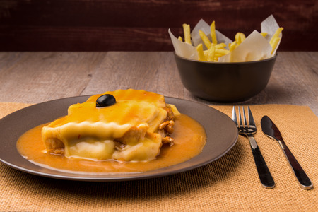 Francesinha and french fries, typical food from Porto, Portugalの写真素材
