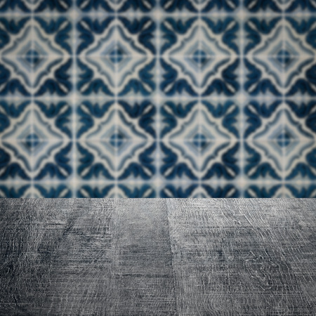 Empty wood table top and blur vintage ceramic tile pattern wall in background, Mock up template for display of your product.の写真素材