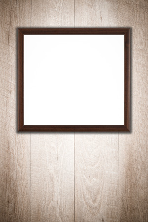 Photo or painting frame on wooden background.の写真素材