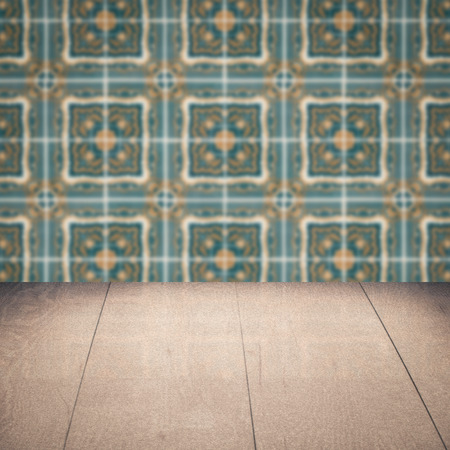Empty wood table top and blur vintage ceramic tile pattern wall in background, Mock up template for display of your product.の写真素材