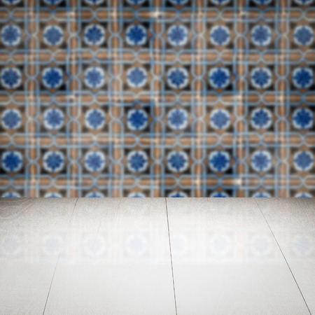 Empty wood table top and blur vintage ceramic tile pattern wall in background, Mock up template for display of your product.の写真素材
