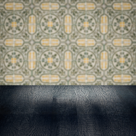 Empty wood table top and blur vintage ceramic tile pattern wall in background, Mock up template for display of your product.の写真素材