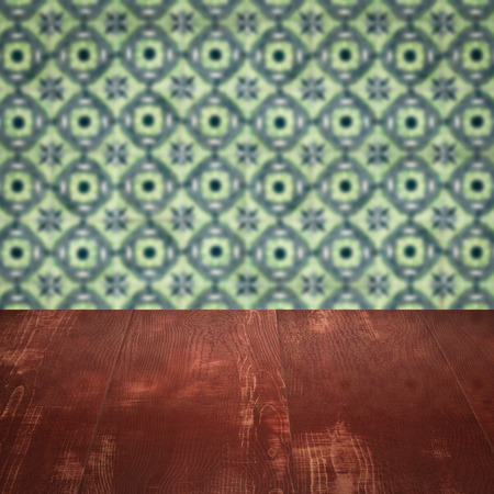 Empty wood table top and blur vintage ceramic tile pattern wall in background, Mock up template for display of your product.の写真素材
