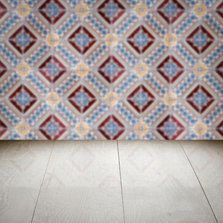 Empty wood table top and blur vintage ceramic tile pattern wall in background, Mock up template for display of your product.の写真素材