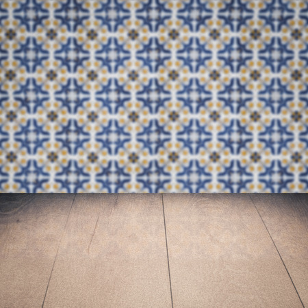 Empty wood table top and blur vintage ceramic tile pattern wall in background, Mock up template for display of your product.の写真素材