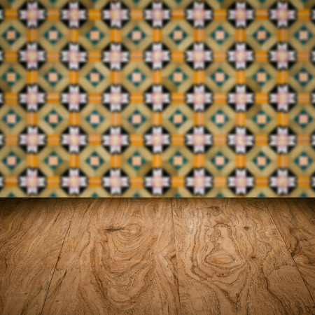 Empty wood table top and blur vintage ceramic tile pattern wall in background, Mock up template for display of your product.の写真素材