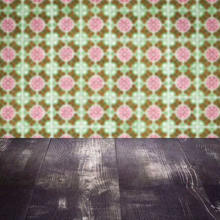 Empty wood table top and blur vintage ceramic tile pattern wall in background, Mock up template for display of your product.の写真素材