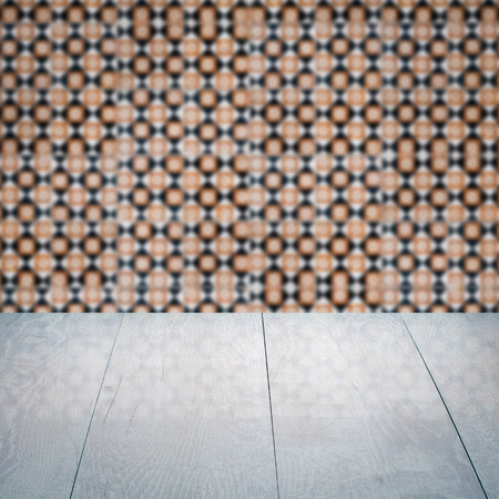 Empty wood table top and blur vintage ceramic tile pattern wall in background, Mock up template for display of your product.の写真素材