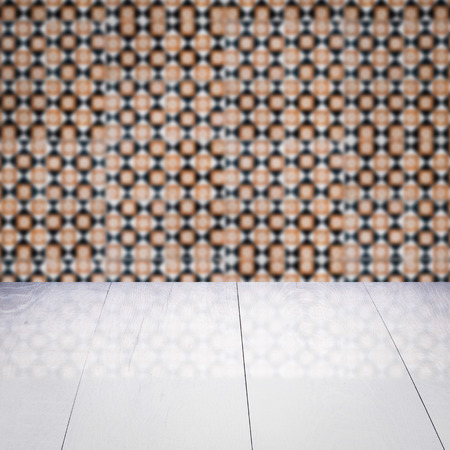 Empty wood table top and blur vintage ceramic tile pattern wall in background, Mock up template for display of your product.の写真素材