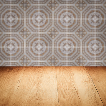 Empty wood table top and blur vintage ceramic tile pattern wall in background, Mock up template for display of your product.の写真素材