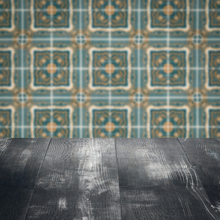 Empty wood table top and blur vintage ceramic tile pattern wall in background, Mock up template for display of your product.の写真素材